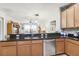Kitchen with breakfast bar and stainless steel appliances at 16020 Starling Crossing Dr, Lithia, FL 33547