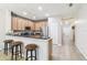 Kitchen with breakfast bar, granite countertops, and stainless steel appliances at 16020 Starling Crossing Dr, Lithia, FL 33547