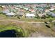 Aerial view showing house location in a neighborhood near a golf course at 1906 Wolf Laurel Dr, Sun City Center, FL 33573
