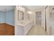 Double vanity bathroom with ample counter space and a separate toilet area at 1906 Wolf Laurel Dr, Sun City Center, FL 33573