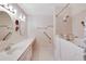 Bathroom boasts a walk-in shower and double vanity at 1906 Wolf Laurel Dr, Sun City Center, FL 33573