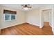 Charming bedroom with wood-look laminate flooring and ample closet space at 1906 Wolf Laurel Dr, Sun City Center, FL 33573