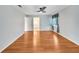 Light and airy bedroom with wood-look flooring and access to a bathroom at 1906 Wolf Laurel Dr, Sun City Center, FL 33573