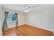 Spacious bedroom featuring wood-look floors and a window at 1906 Wolf Laurel Dr, Sun City Center, FL 33573