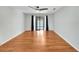Spacious bedroom with wood-look laminate flooring and sliding glass doors at 1906 Wolf Laurel Dr, Sun City Center, FL 33573