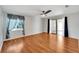 Bright bedroom with wood-look flooring and sliding doors to a patio at 1906 Wolf Laurel Dr, Sun City Center, FL 33573