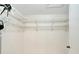 Large walk-in closet with wire shelving for storage at 1906 Wolf Laurel Dr, Sun City Center, FL 33573