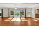 Bright dining room with hardwood floors and view to backyard at 1906 Wolf Laurel Dr, Sun City Center, FL 33573