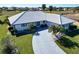 Single story home with tile roof and landscaped yard at 1906 Wolf Laurel Dr, Sun City Center, FL 33573