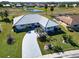 Single-story home with tile roof and landscaped yard at 1906 Wolf Laurel Dr, Sun City Center, FL 33573