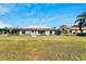 House exterior showcasing the backyard and screened patio at 1906 Wolf Laurel Dr, Sun City Center, FL 33573