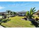 Single-story home with well-manicured landscaping and a two-car garage at 1906 Wolf Laurel Dr, Sun City Center, FL 33573