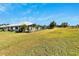 House exterior showcasing a large backyard and green lawn at 1906 Wolf Laurel Dr, Sun City Center, FL 33573
