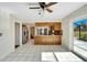 Bright kitchen with island and access to backyard patio at 1906 Wolf Laurel Dr, Sun City Center, FL 33573