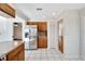 Modern kitchen with stainless steel appliances and wood cabinets at 1906 Wolf Laurel Dr, Sun City Center, FL 33573