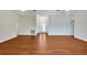 Spacious living room with wood-look floors and vaulted ceilings at 1906 Wolf Laurel Dr, Sun City Center, FL 33573