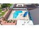 Large community pool with hot tub and lounge chairs at 1906 Wolf Laurel Dr, Sun City Center, FL 33573