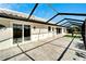 Spacious screened patio with paver tile and a view of the backyard at 1906 Wolf Laurel Dr, Sun City Center, FL 33573