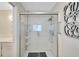 Walk-in shower with glass enclosure and multiple shelves at 1906 Wolf Laurel Dr, Sun City Center, FL 33573