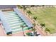 Covered shuffleboard courts with palm trees and seating at 1906 Wolf Laurel Dr, Sun City Center, FL 33573