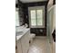 Bathroom with white vanity, toilet, and shower at 200 Carmona Ne Way, St Petersburg, FL 33704