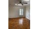 Bright bedroom with wood floors, plantation shutters, and a ceiling fan at 200 Carmona Ne Way, St Petersburg, FL 33704