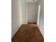 Empty room with parquet flooring and white walls at 200 Carmona Ne Way, St Petersburg, FL 33704