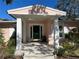 Classic front entry with a pink brick facade and a green door at 200 Carmona Ne Way, St Petersburg, FL 33704