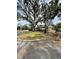 Residential property with large oak trees and a manicured lawn at 200 Carmona Ne Way, St Petersburg, FL 33704