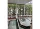 Screened patio with a hot tub and privacy hedges at 200 Carmona Ne Way, St Petersburg, FL 33704