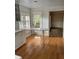 Kitchen with white cabinets, wood floors, and a breakfast bar at 200 Carmona Ne Way, St Petersburg, FL 33704