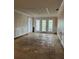 Living room featuring French doors, crown molding, and wood floors at 200 Carmona Ne Way, St Petersburg, FL 33704