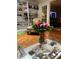 Living room with hardwood floors, built in shelving, and a large bouquet of flowers at 200 Carmona Ne Way, St Petersburg, FL 33704