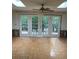 Bright living room with parquet flooring, French doors, and skylights at 200 Carmona Ne Way, St Petersburg, FL 33704