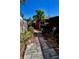 Brick pathway and lush landscaping in backyard at 2655 Miriam S St, Gulfport, FL 33711