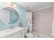 Clean bathroom with a shower/tub combo and modern vanity at 3101 Lake Pine Way # H3, Tarpon Springs, FL 34688