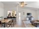 Open living area with hardwood floors and a view into the kitchen at 3101 Lake Pine Way # H3, Tarpon Springs, FL 34688