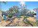 Large backyard with wooden fence and some plants at 3419 Machado St, Tampa, FL 33605