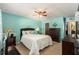 Spacious bedroom with a queen bed and ceiling fan at 3515 King Richard Ct, Seffner, FL 33584