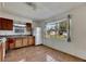 Bright kitchen with wood cabinets, white appliances, and tiled floor at 3712 56Th N Ave, St Petersburg, FL 33714