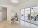 Bright dining area with sliding doors leading to patio at 4603 Topsail Trl, New Port Richey, FL 34652