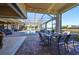 Relaxing pool area with covered patio and dining space at 5407 Tybee Island Dr, Apollo Beach, FL 33572