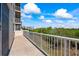 Private balcony overlooking lush landscape and partial water view at 6399 Shoreline Dr # 4106, St Petersburg, FL 33708