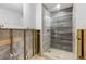 Bathroom with a modern glass shower and gray tile at 9111 Gulf Blvd, St Pete Beach, FL 33706