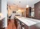 Open kitchen features granite island and dark wood cabinetry at 912 Channelside Dr # 2420, Tampa, FL 33602