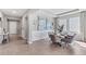 Elegant dining room with a modern table and chairs, and a view of the entryway at 10729 Tippecanoe Pl, Parrish, FL 34219