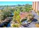 Aerial view of condo building and surrounding landscape, including pool and pond at 12077 Gandy N Blvd # 374, St Petersburg, FL 33702