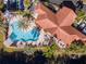 Aerial view of pool, building, and surrounding landscape at 12077 Gandy N Blvd # 374, St Petersburg, FL 33702