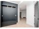 Elegant entryway with built-in bench and dark accent wall at 12077 Gandy N Blvd # 374, St Petersburg, FL 33702