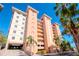Condo building with Mediterranean style, ample parking and palm trees at 12077 Gandy N Blvd # 374, St Petersburg, FL 33702